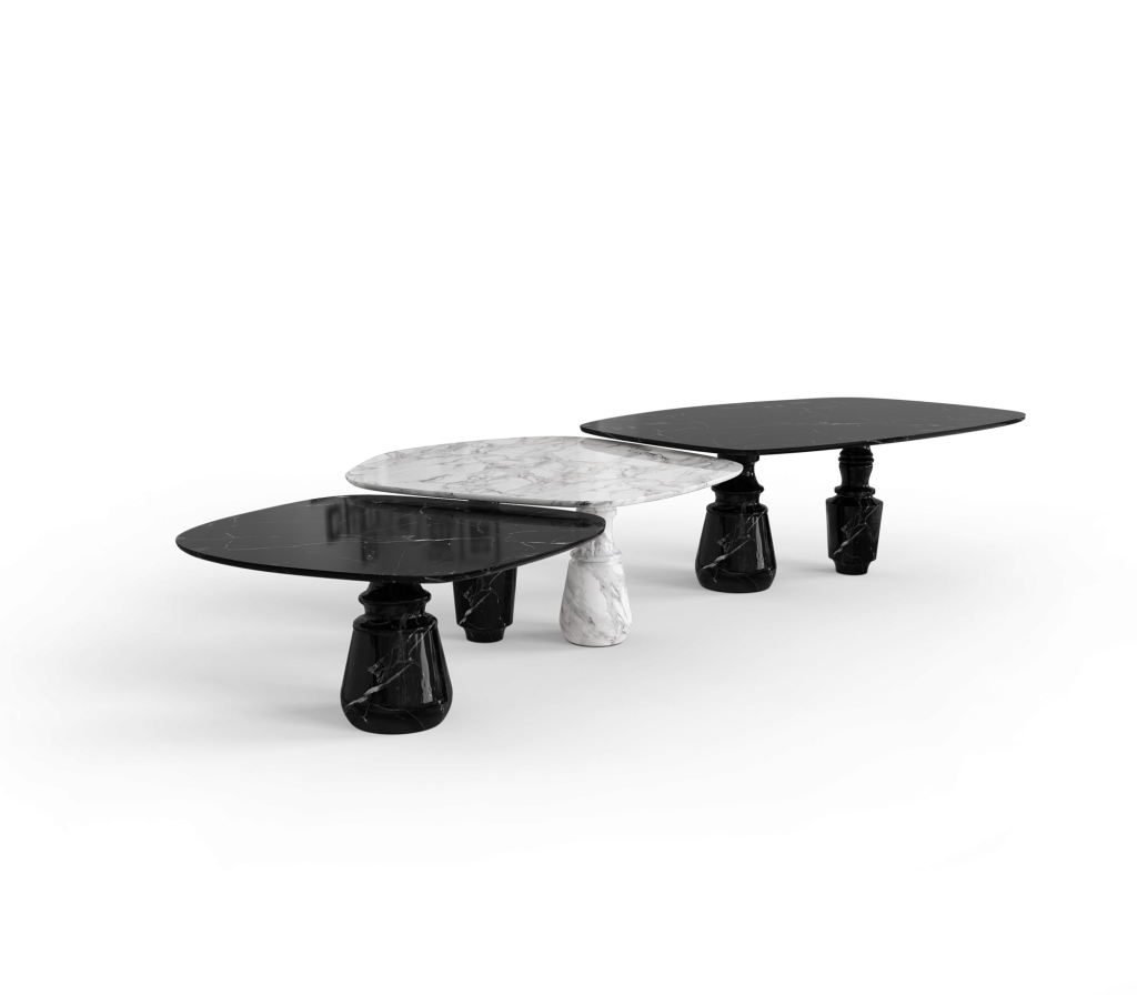 Set of nesting black and white marble tables with sculpted pedestal legs, studio shot -luxury dining table