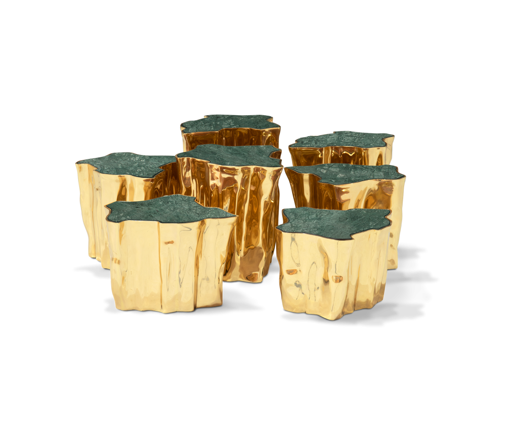 Set of gold sculptural side tables with rippled metallic bases and green marble tops, arranged in a cluster -four seasons hotel taormina