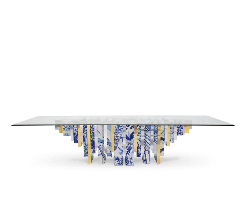 Glass-top table with alternating blue-and-white azulejo tile and gold panel legs, studio shot -luxury dining table