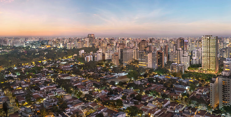 Aerial panoramic view of a neighborhood at dusk, with red-tiled rooftops and illuminated high-rises -top places to live in São Paulo