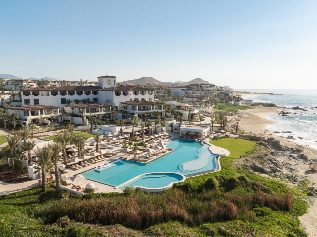 Aerial view of the beachfront pool and luxury resort at Four Seasons Los Cabos