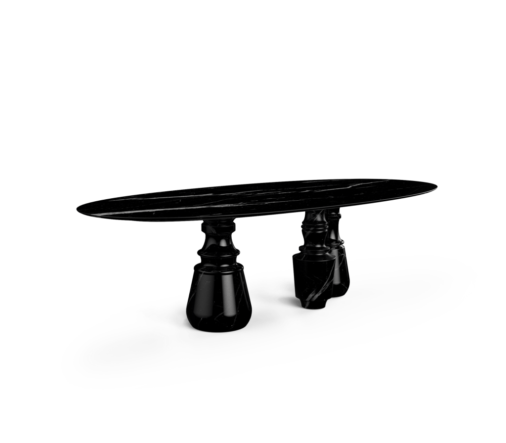Oval black marble table with sculptural marble pedestal legs, studio shot -luxury dining table