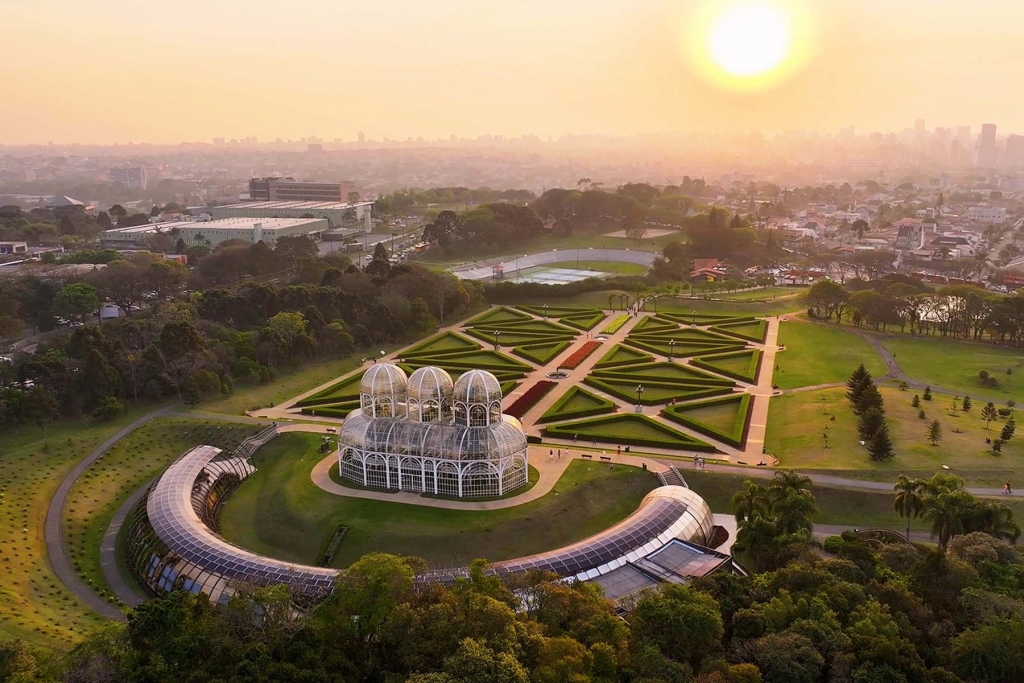 Aerial view of illuminated high-rise buildings in Curitiba at golden hour -the best places to live in brazil