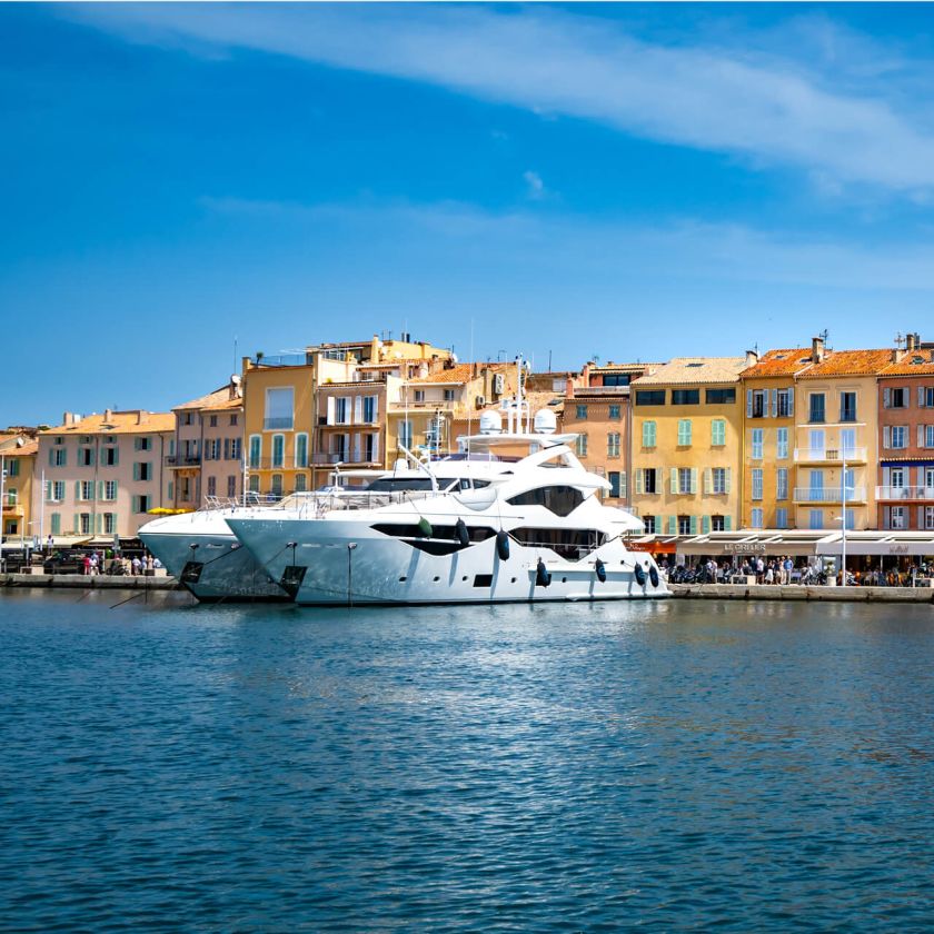 Yacht Destinations — luxury yacht moored in Saint-Tropez on the French Riviera, surrounded by the Mediterranean coastline