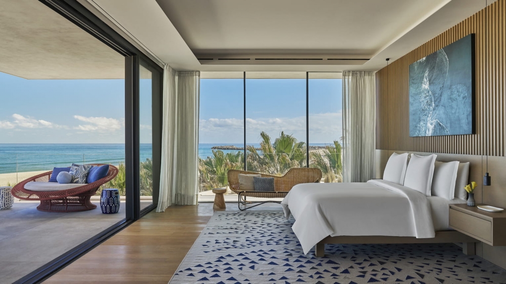 Modern beachfront hotel room with ocean view balcony at Four Seasons Los Cabos