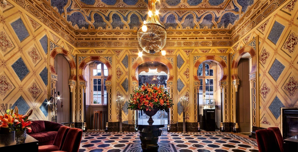 Ornate Moorish-style hotel lobby with painted ceiling and chandelier -pestana