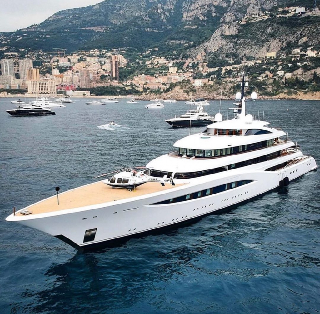 Yacht Destinations — luxury yacht cruising along the coastline of Ibiza, Spain, surrounded by the crystal-clear Mediterranean Sea
