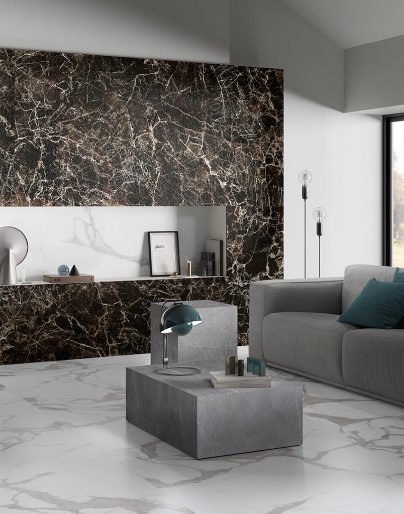 Modern living room with dark veined marble panel, niche shelf and grey stone coffee table - fall winter 2027 trends