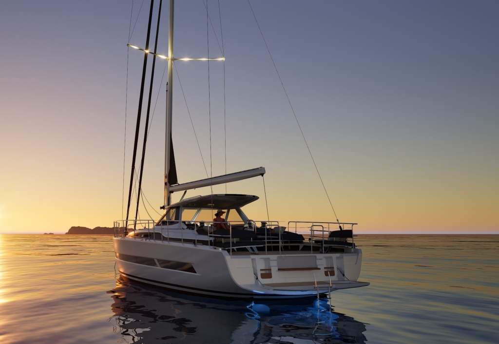 An aerial view of a luxurious sailing yacht gliding through the sea, showcasing its wooden deck and large branded sails at the Cannes Yachting Festival 2026.