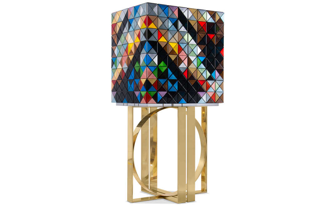 Luxury decorative cabinet featuring a geometric pattern of multi-colored panels in various colors and finishes, supported by a polished gold metal structured base.