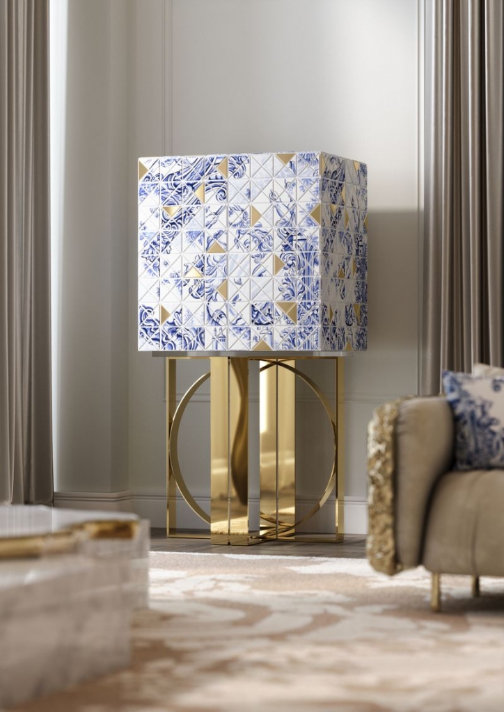 Pixel Heritage cabinet featuring blue and white Portuguese azulejo-inspired tile pattern with gold triangle accents on a gold ring base, in a neutral living room – statement sideboard.