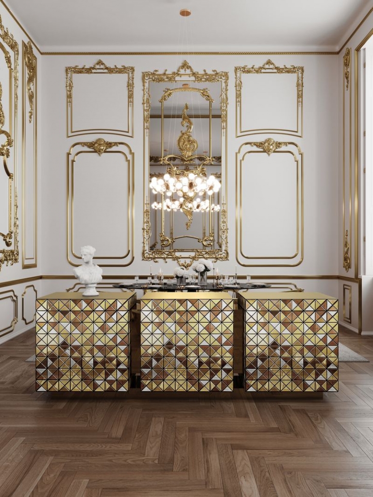 Trio of gold faceted Pixel Anodized cube cabinets forming a long sideboard, in an ornate gold and white dining room – statement sideboard.
